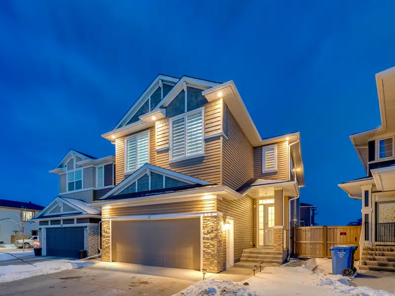 Calgary home with a heavy double garage door supported by torsion springs