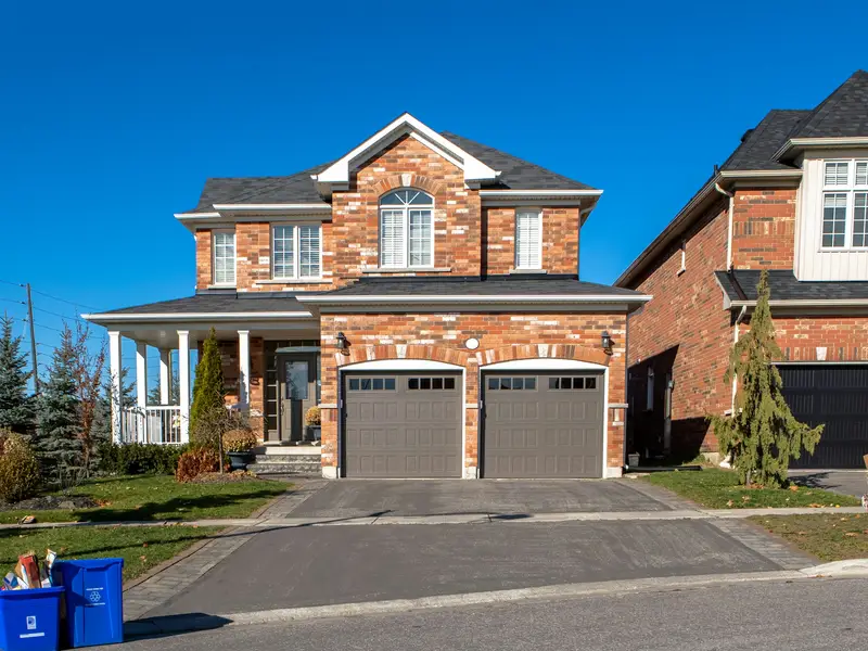 Calgary suburban home with a new insulated garage door installed by Proline